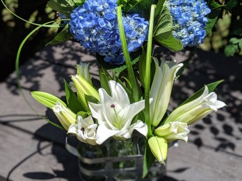 Blue hydrangeas with white lilies