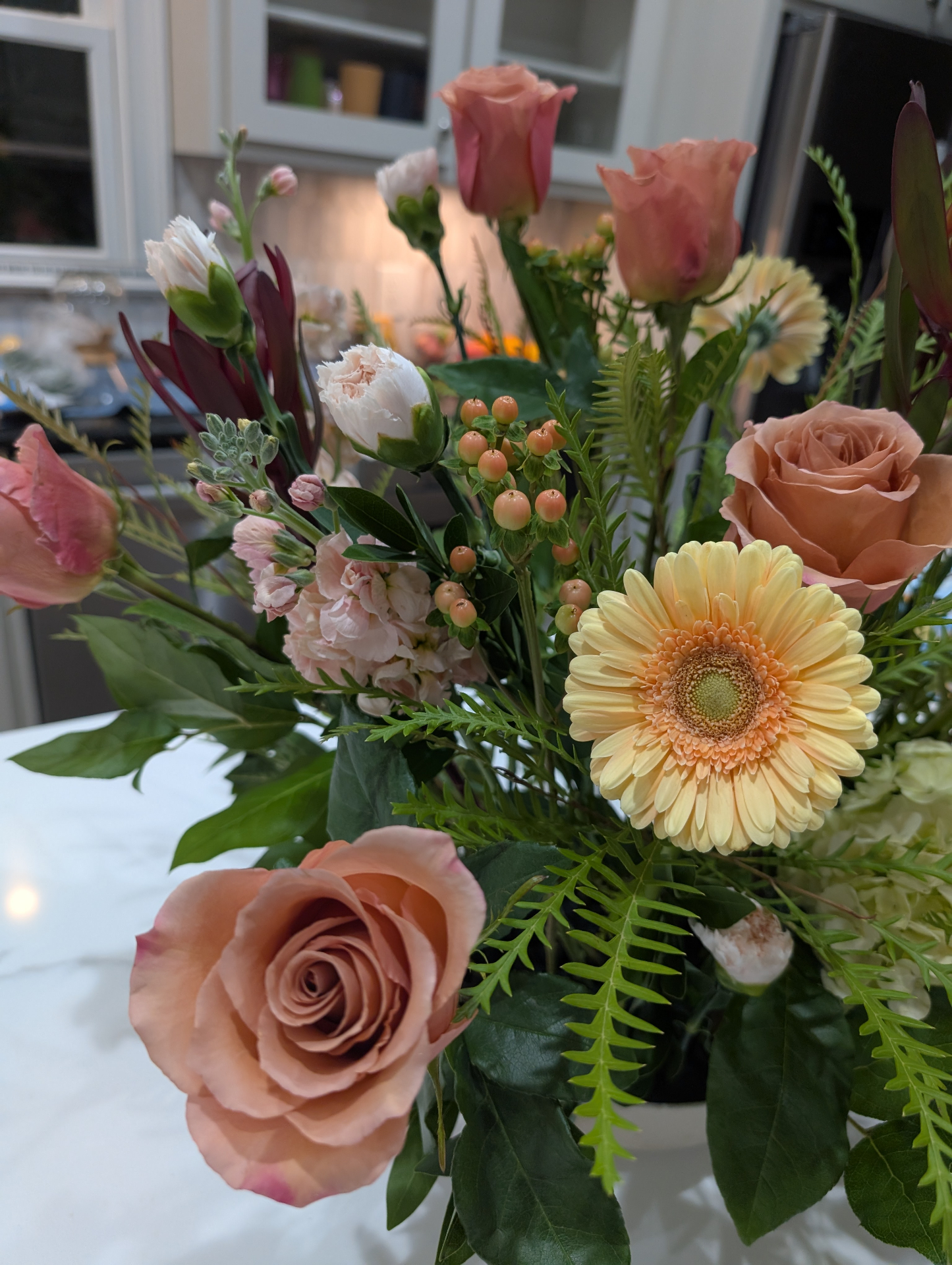 Peach roses and yellow gerbera mixed arrangement