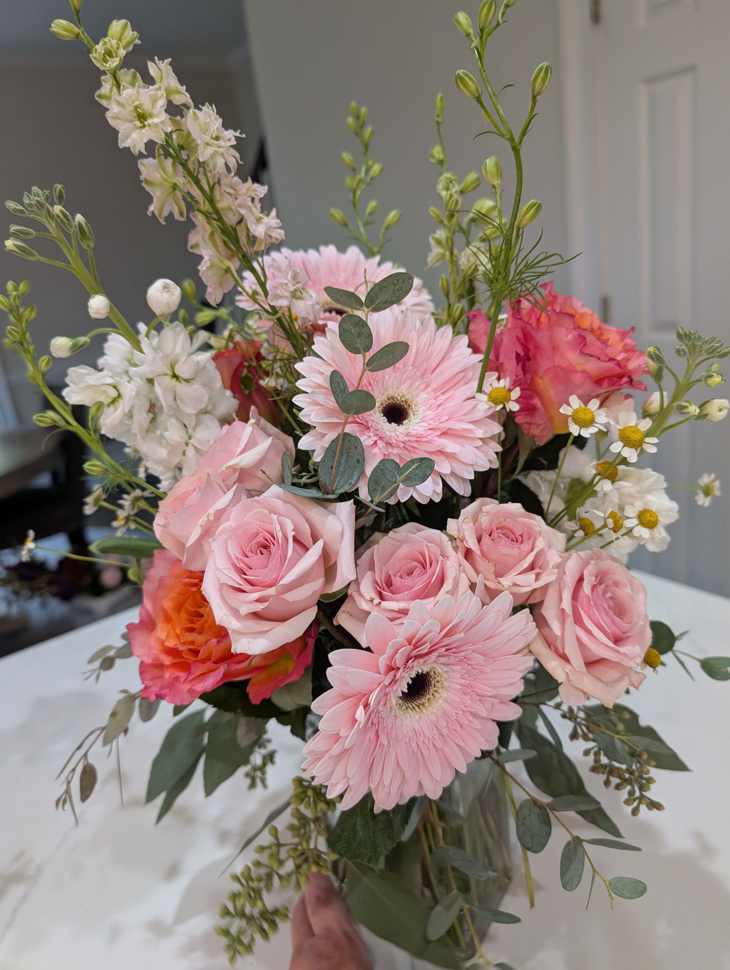 Pink roses and gerbera daisies centerpiece
