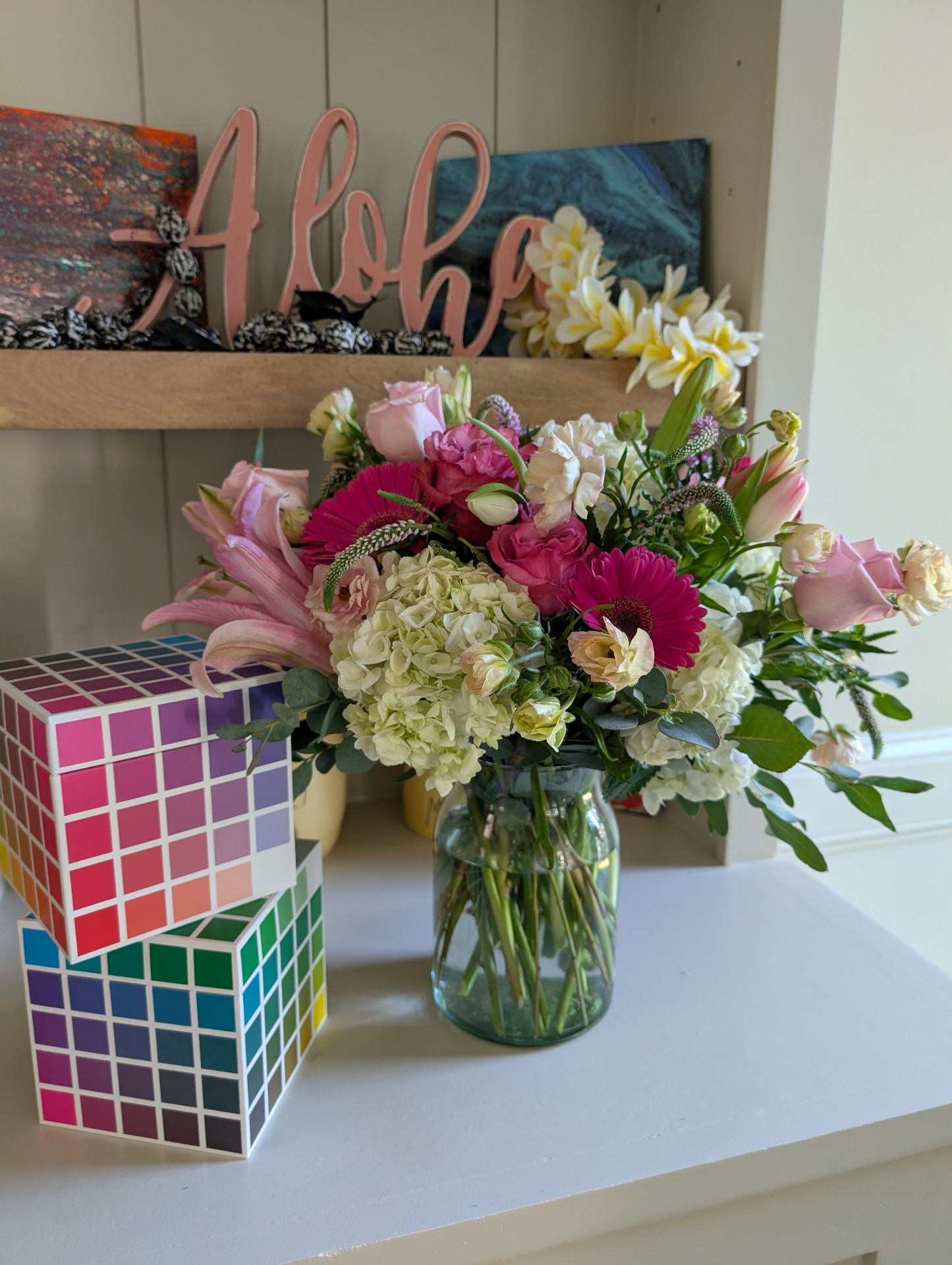 Pink gerbera daisies with white hydrangeas and roses