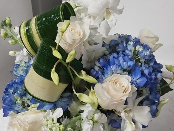 White rose and blue hydrangea centerpiece